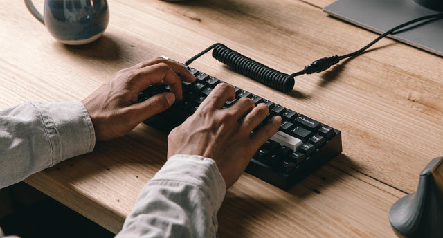 close up of man typing on tofu65 mechanical keyboard