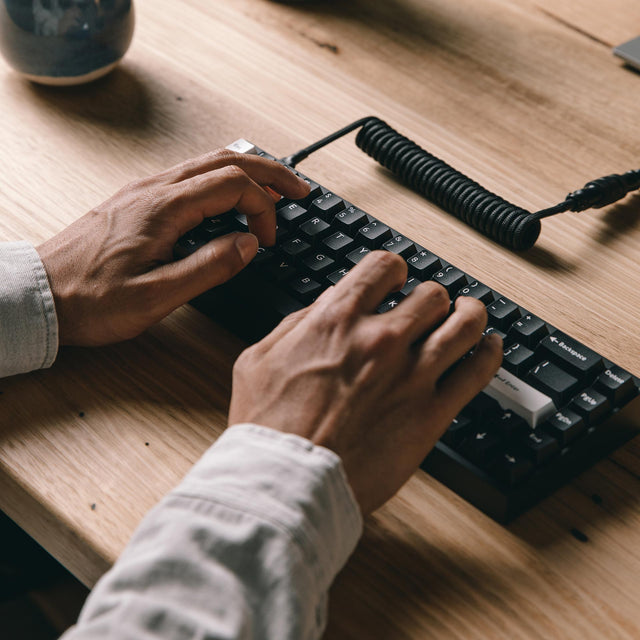 close up of man typing on tofu65 mechanical keyboard